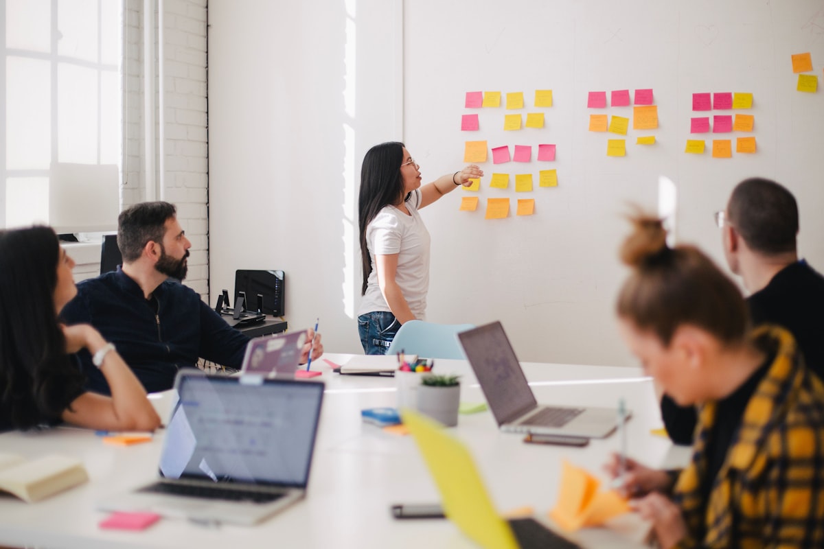 Software team collaborating in a bright workshop