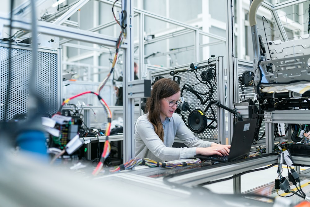 Engineer working at a laptop in a modern lab